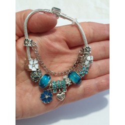 Bracciale donna sterling ( argento laminato), 925 marchiato tema  fiorellini e turchesi, completo di charms come in foto